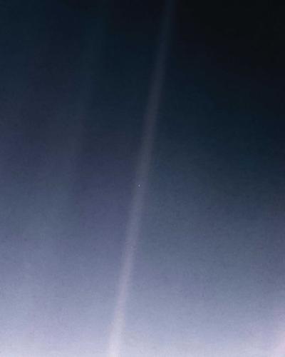 This image shows an updated version of the iconic Pale Blue Dot image taken by the Voyager 1 spacecraft.